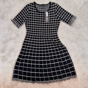 Nina Leonard, black and white patterned dress